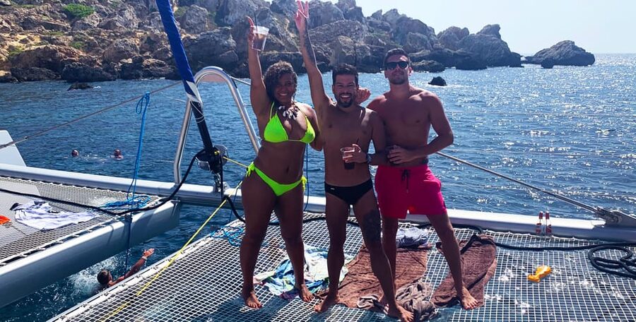 Malta: Blue Lagoon Evening Catamaran Cruise - Sunset, music, and the onboard “social” mood