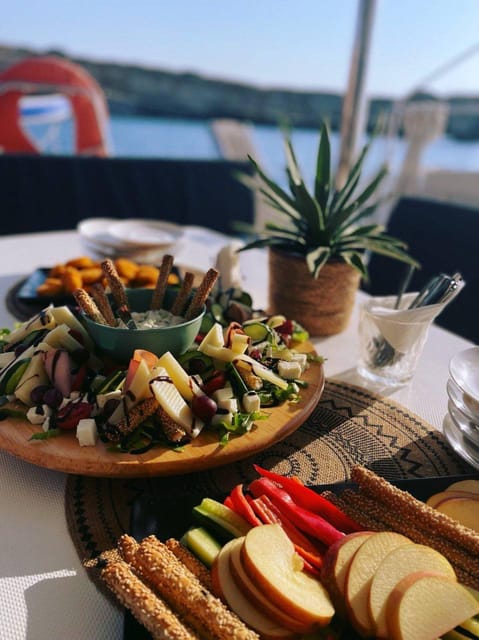 Milos: Kleftiko Sunset Catamaran Cruise with Meal & Drinks - Entering Day Mode at Adamantas Port