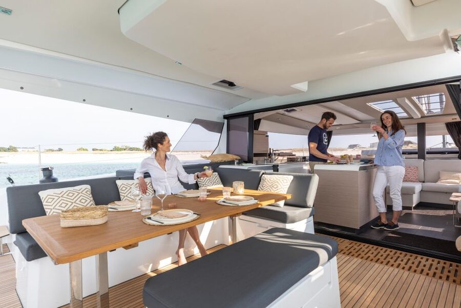 Mykonos: Catamaran Cruise with 3-Course Meal and Transfers - First contact: pickup, safety briefing, and getting onto Aerial or White Coral
