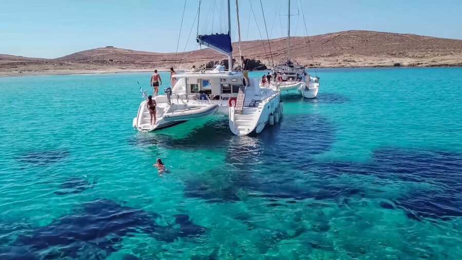 Mykonos: Catamaran Cruise with Lunch, Drinks and Transfer - Rhenia Island’s anchoring cove: where the best hours happen
