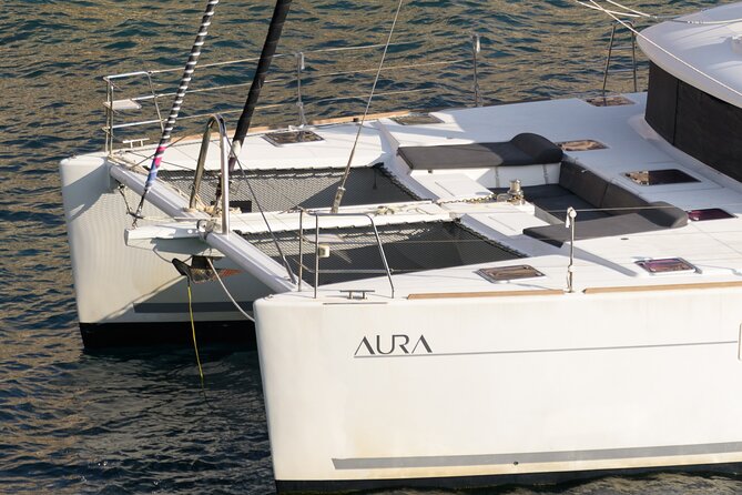 Mykonos Catamaran Sunset Cruise with Meal, Drinks & Transfer - Transfers, Meeting Point, and the Tender Ride Reality