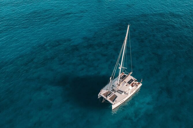 Mykonos: Private Catamaran Cruise—Hotel Pickup, BBQ & Drinks - Private Mykonos catamaran with hotel pickup: start smooth