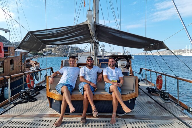 Mykonos Sail Cruise to Rhenia, Guided Tour of Delos, Lunch&Drinks - Rhenia Island Swim: Golden Sand, Clear Water, and Snorkel Gear Included