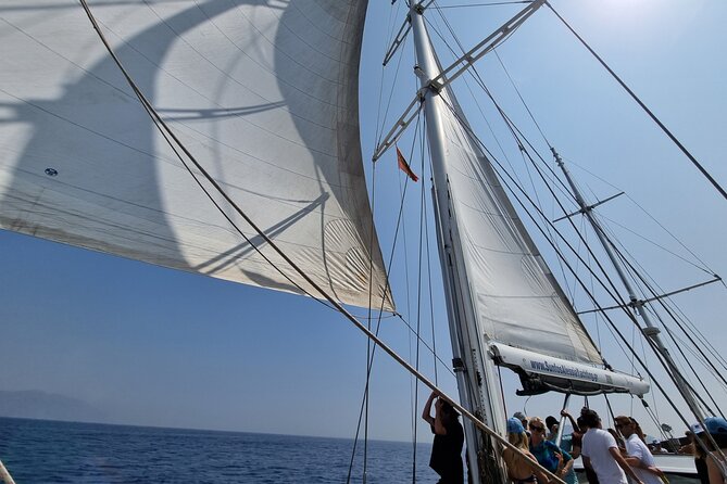 Mykonos Sail Cruise to Rhenia, Guided Tour of Delos, Lunch&Drinks - Reboarding for the Return to Mykonos: The Farewell Toast Moment