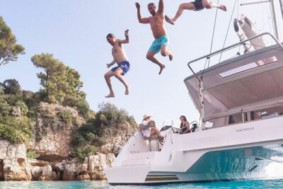 Mykonos Shared Catamaran Tour Experience - Delos ruins: the boat view and what the crew typically points out