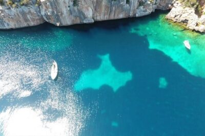 One day excursion on a sailing boat in the Gulf of Alghero - Cala Dragunara: The Long Swim, Lunch, and Float Time