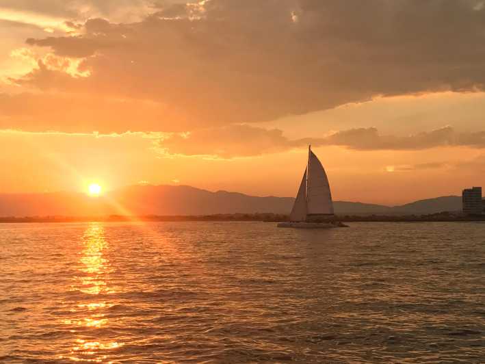 Palma de Mallorca: Sunset Sailing Catamaran Trip with Drink - Onboard vibe: music, seating, and your included drink