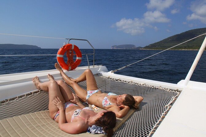 Porto Conte: Half-day catamaran tour with aperitif - The aperitif on board: Sardinian sausage, pecorino, and white wine