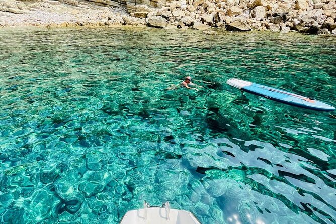 Porto Conte: Half-day catamaran tour with aperitif - Group size, guides, and the skipper effect (Toni on the wheel)