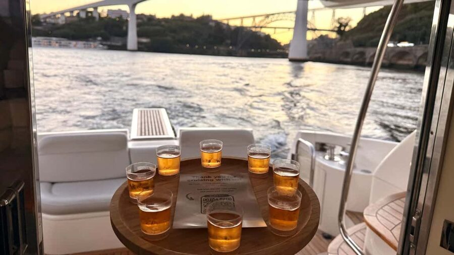 Porto: Luxury 6 Bridges Yacht Cruise with Wine & Snacks - Wine and regional tasting board: what to expect on board