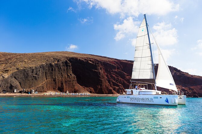 Premium Small-Group Catamaran Cruise with BBQ, Open Bar, Transfer - Apronisi and the caldera coast: the views that justify the boat