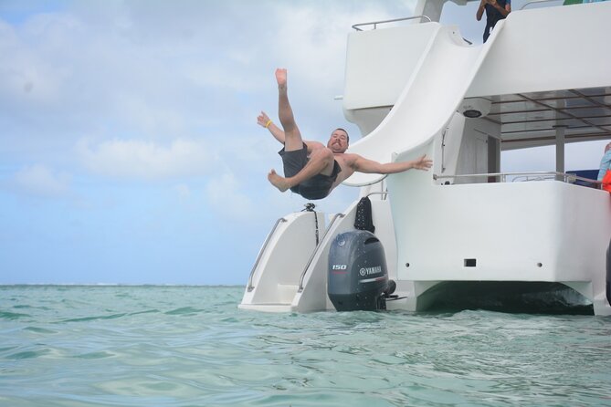 Private Catamaran with Sound system, Slide, Open bar & Snorkeling - Stop 2: Natural Pool sandbar time with a floating bar