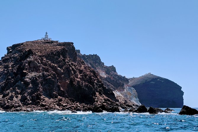 Private Full-Day Motor Yacht Cruise with Meal, Open Bar+Transfers - From Vlychada to Red Beach: the swim-stop that sets the tone