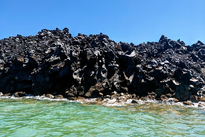 Private Full-Day Motor Yacht Cruise with Meal, Open Bar+Transfers - Akrotiri Lighthouse and the scenic sail through the caldera