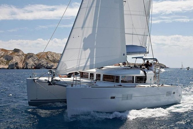 Private Luxury Santorini Catamaran Cruise with Port Pickup - Onboard comfort: towels, restrooms, masks, and the general vibe
