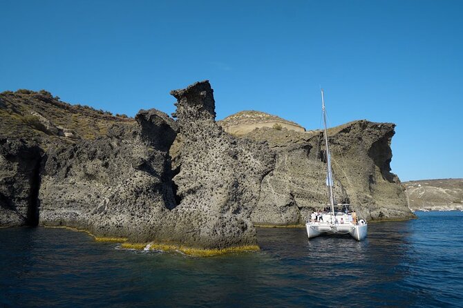 Private Luxury Santorini Catamaran Cruise with Port Pickup - Lunch or dinner on anchor: grilled chicken, Greek spreads, salad