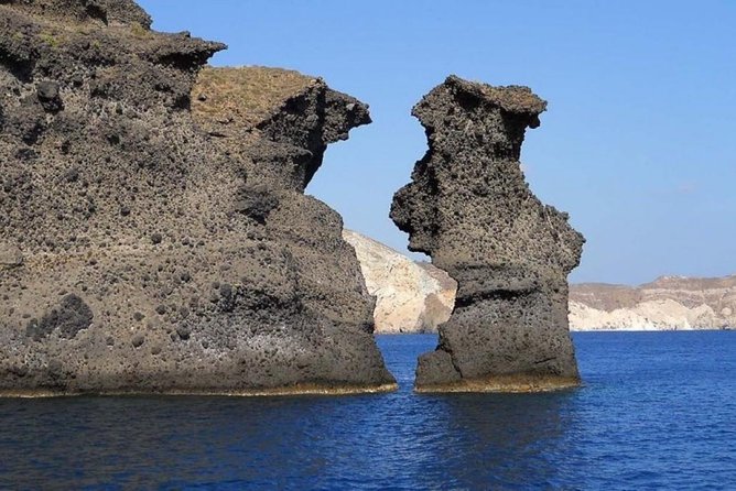 Private Luxury Santorini Catamaran Cruise with Port Pickup - Pickup and meeting points for port, airport, and Santorini hotels