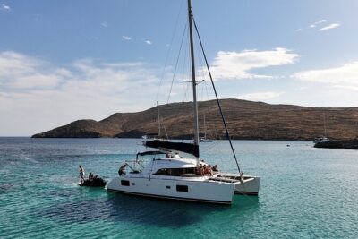 Private Mykonos Catamaran Day Cruise with Meals & Water Toys - Delos from the water: ruins without the heavy logistics