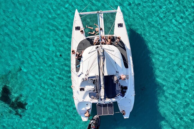 Private Mykonos Catamaran Day Cruise with Meals & Water Toys - Stand up paddle board time and water play (without the chaos)