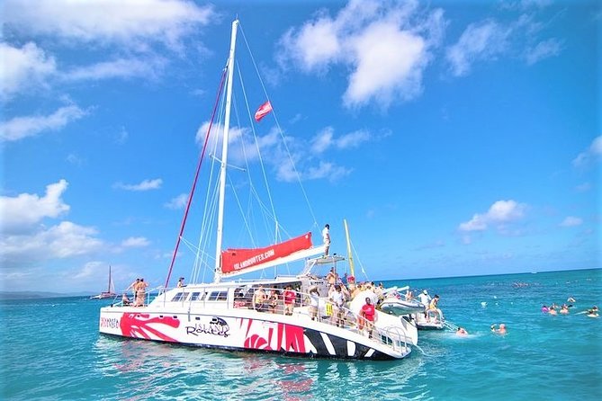 Reggae Catamaran and Snorkeling Open Bar Cruise Montego Bay - Doctor’s Cave Beach snorkeling: short stop, calm water, and beginner-friendly vibes