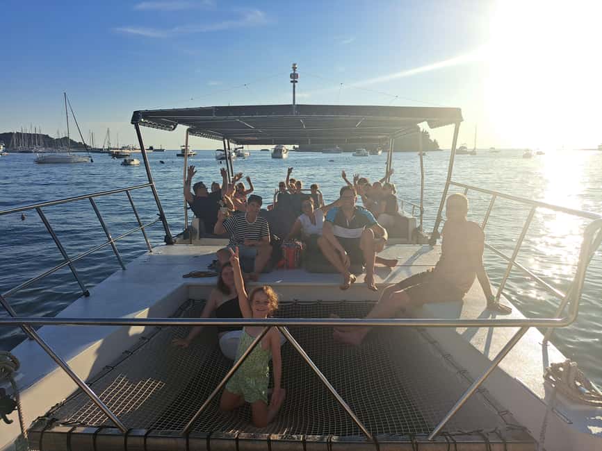 Rovinj: Sunset & dolphin group tours with Catamaran - Getting Great Photos: Net-Front Fun and Best Viewing Moments