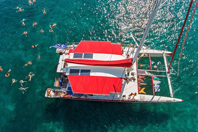 Sailing Catamaran Cruise in Santorini with BBQ, Drinks and Transfer - Getting aboard: transfers, ports, and the shoes-off moment