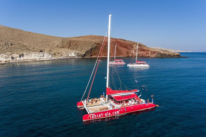 Sailing Catamaran Cruise in Santorini with BBQ, Drinks and Transfer - Hot Springs swim: how close you get (and what to expect)