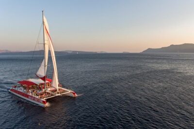 Sailing Catamaran Cruise in Santorini with BBQ, Drinks and Transfer - Sailing the caldera: volcano views and timed water breaks