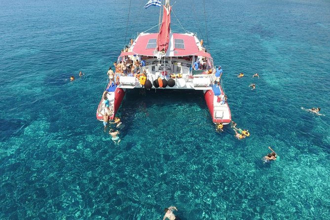 Sailing Catamaran Cruise in Santorini with BBQ, Drinks and Transfer - White Beach plus BBQ: where hunger meets the sea