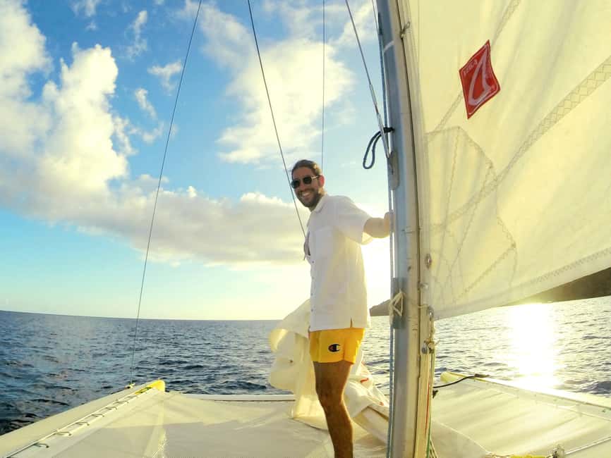Sailing catamaran in La Baie des Saintes - Hoisting sails: how the crew turns sailing into an activity