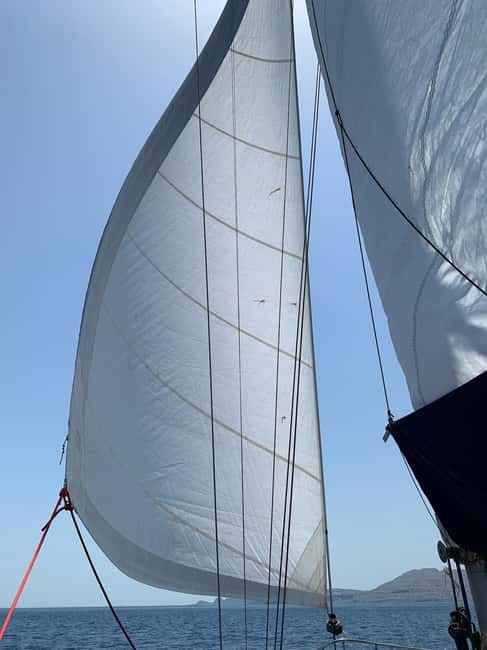 Sailing tour around Lindos with food and drinks - Lunch onboard: Greek food, fruits, and drinks that keep momentum going