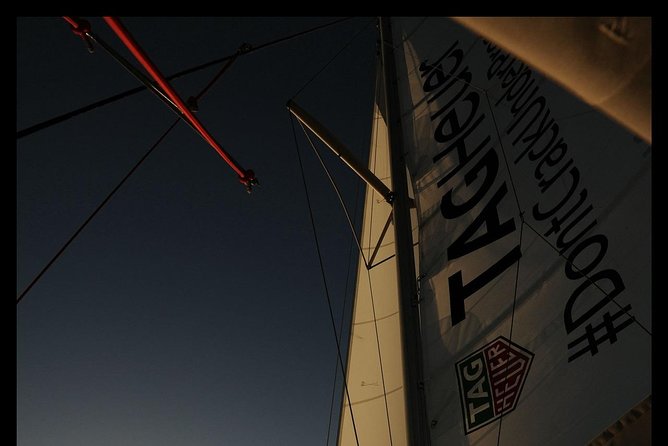 Santorini Adventurous Catamaran Experience with Snorkeling - Akrotiri’s Cliffside Sailing: the Venetian Lighthouse Moment