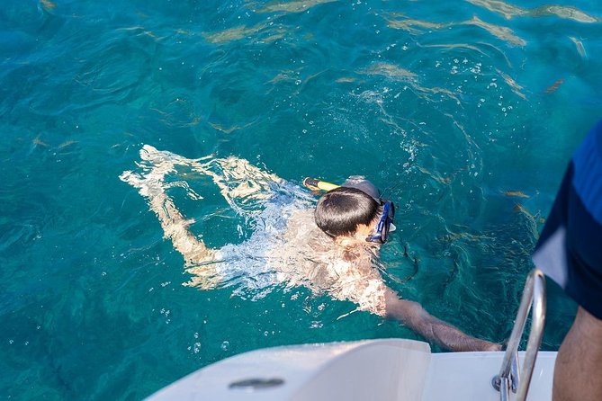 Santorini Adventurous Catamaran Experience with Snorkeling - Mesa Pigadia, Black Mountain, and Indian Rock: the Scenic In-Between