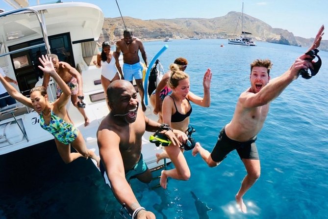 Santorini All-inclusive Catamaran Cruise with Thirassia Stop - The in-between sailing: Black Mountain, Indian Rock, and the lighthouse views