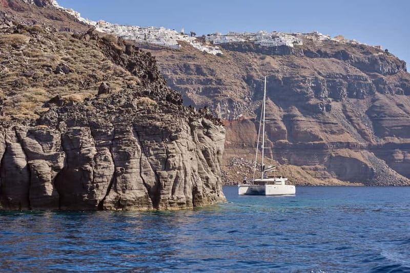 Santorini: Caldera Classic Catamaran Cruise w/ Meal & Drinks - Akrotiri Lighthouse and Indian Face Mountain: Views Without the Footwork