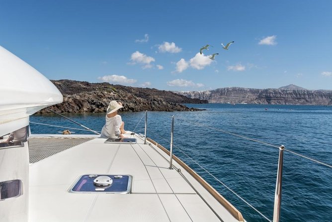 Santorini Caldera Sailing Tour with BBQ Lunch and Drinks - Seeing Indian Head Mountain and the Old Venetian Lighthouse from the deck