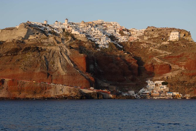 Santorini Caldera Sunset Sailing Cruise with Dinner and Wine - Oia sunset from the water: best way to watch without crowds