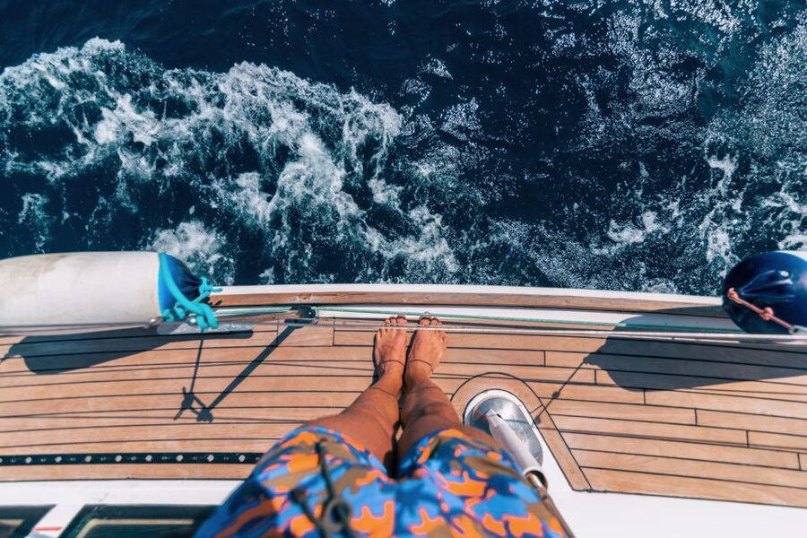 Santorini Caldera: Sunset Sailing Cruise with Meal - Sailing toward Akrotiri Lighthouse and inside the caldera