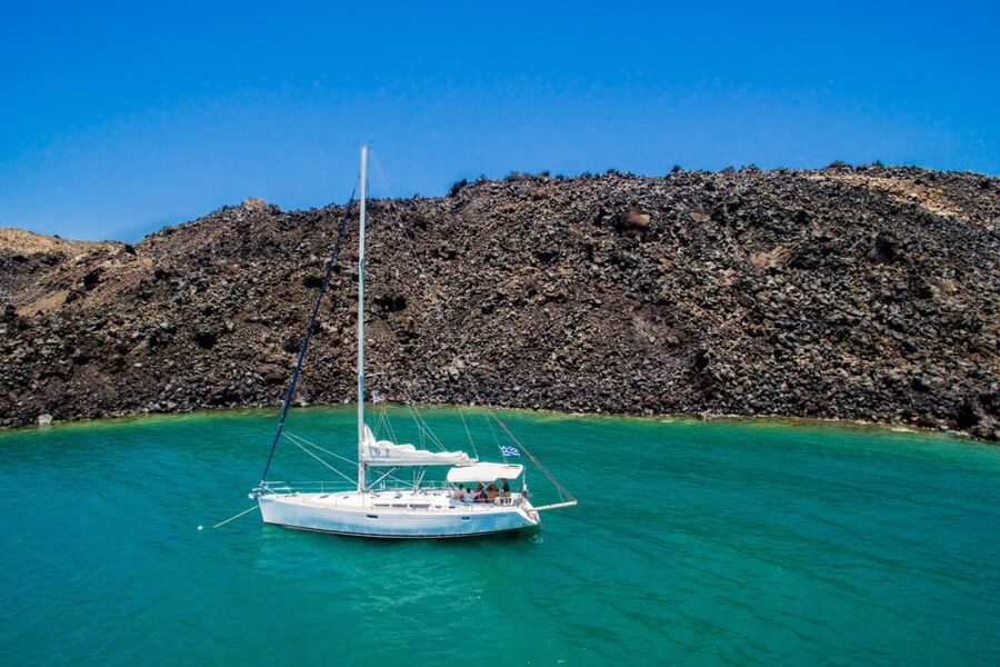 Santorini Caldera: Sunset Sailing Cruise with Meal - Palea Kameni and Nea Kameni: the hot-spring zone and volcanic beaches