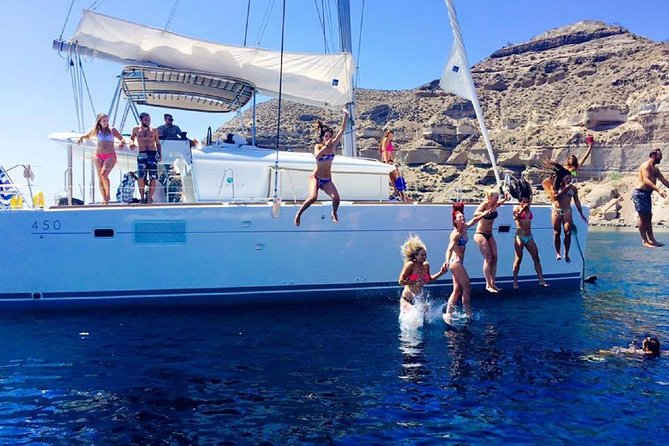 Santorini Catamaran Cruise with Fresh Meal and Open Bar - Sailing Past Lighthouses, Black Mountain, and Indian Rock