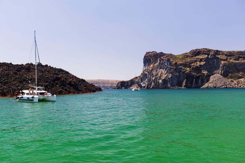 Santorini: Catamaran Cruise with Fresh Meal & Open Bar - Open bar and deck comfort: relaxed fun with real supervision