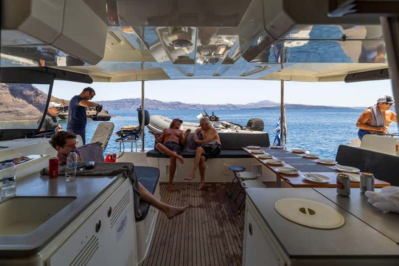 Santorini: Catamaran Cruise with Fresh Meal & Open Bar - When sunset matters: how timing changes the atmosphere