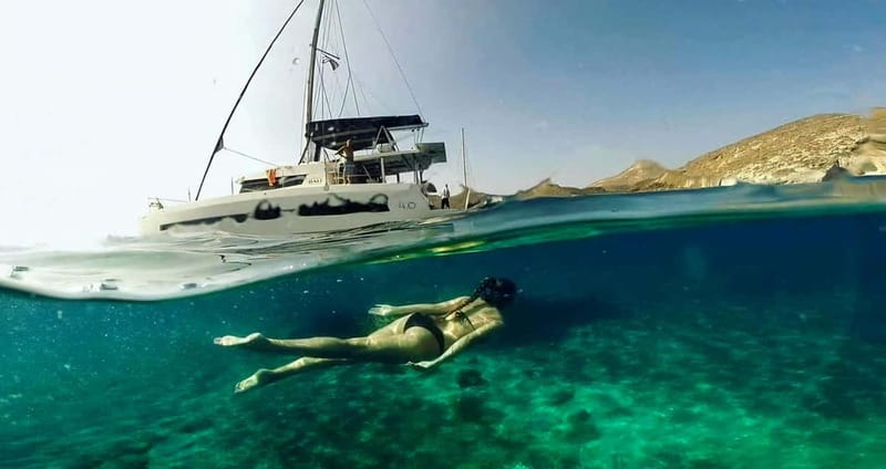 Santorini: Catamaran Cruise with Fresh Meal & Open Bar - Sailing past Red and White Beach: quick photo stops, big payoff