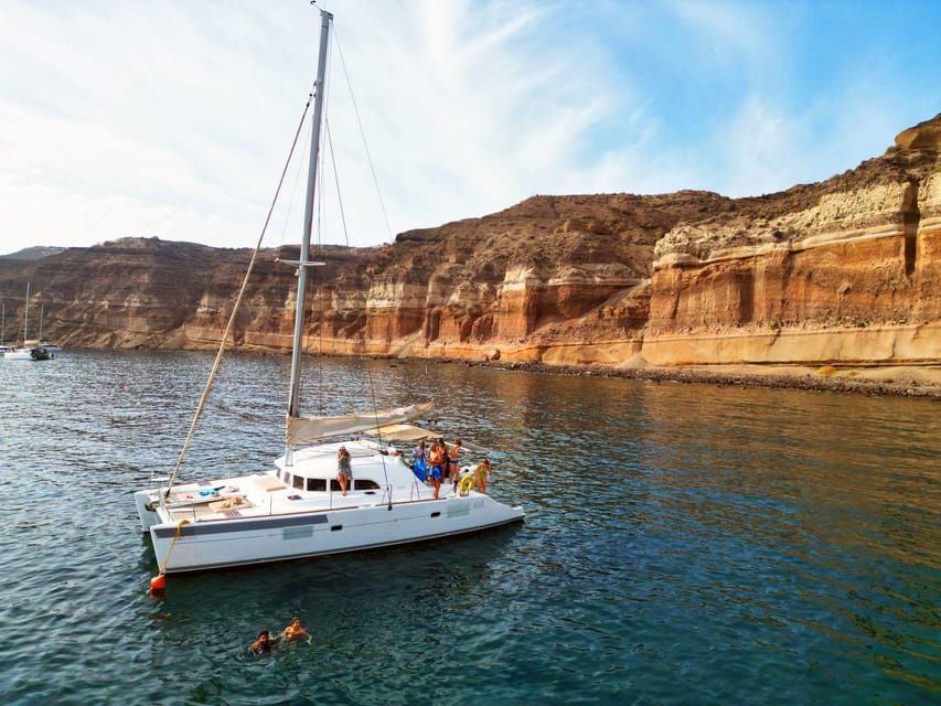 Santorini: Catamaran Cruise with Greek BBQ and Drinks - Red Beach and the Red Rocks: Where Your Day Becomes Real Swim Time