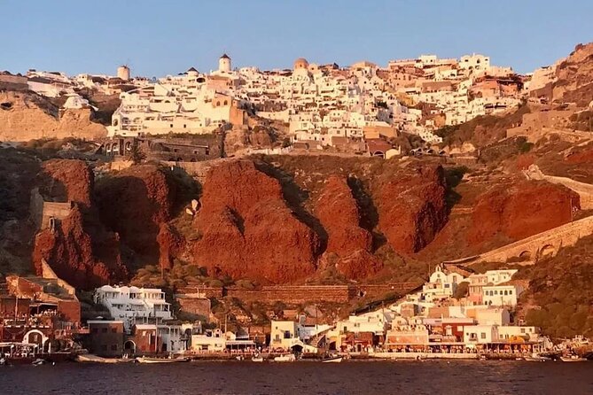 Santorini Catamaran Cruise with Greek Meal, Open-Bar and Sunset - Caldera and South Coast Cruising: Lighthouse to White Beach Views