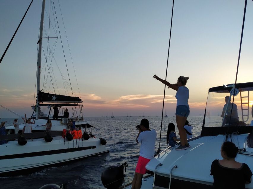 Santorini: Catamaran Cruise with Meal & Open Bar - Cruising the Caldera on a small catamaran (not a floating cattle car)