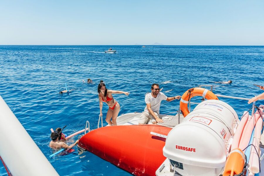 Santorini: Catamaran Tour with BBQ Dinner, Drinks, and Music - First Swim: Hot Springs and Sulfur-Warm Water