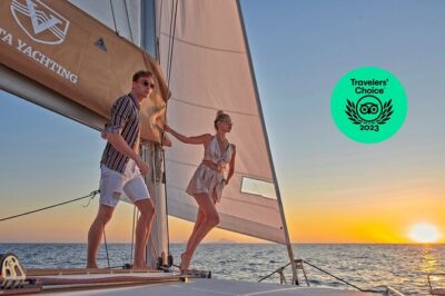 Santorini Gold Catamaran Cruise with BBQ, Drinks and Hotel Pickup - Venetian Lighthouse Photos and Coastal Snapshots