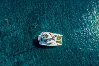 Santorini Half Day Catamaran Private Cruise incl. Meal, Drinks & Free Transport - Getting on board: pickup windows, timing rules, and passport reality
