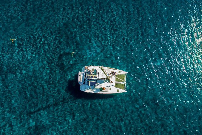 Santorini Half Day Catamaran Private Cruise incl. Meal, Drinks & Free Transport - Getting on board: pickup windows, timing rules, and passport reality